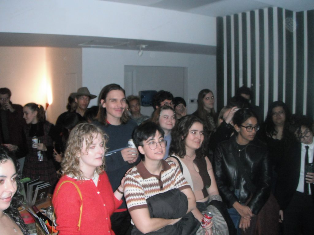 A crowd watching a performance at Sunstroke Press' fall 2024 fundraiser.