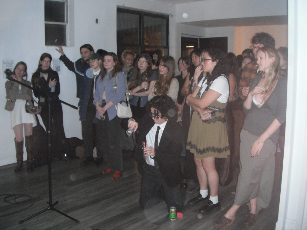 A crowd watching a performance at Sunstroke Press' fall 2024 fundraiser.