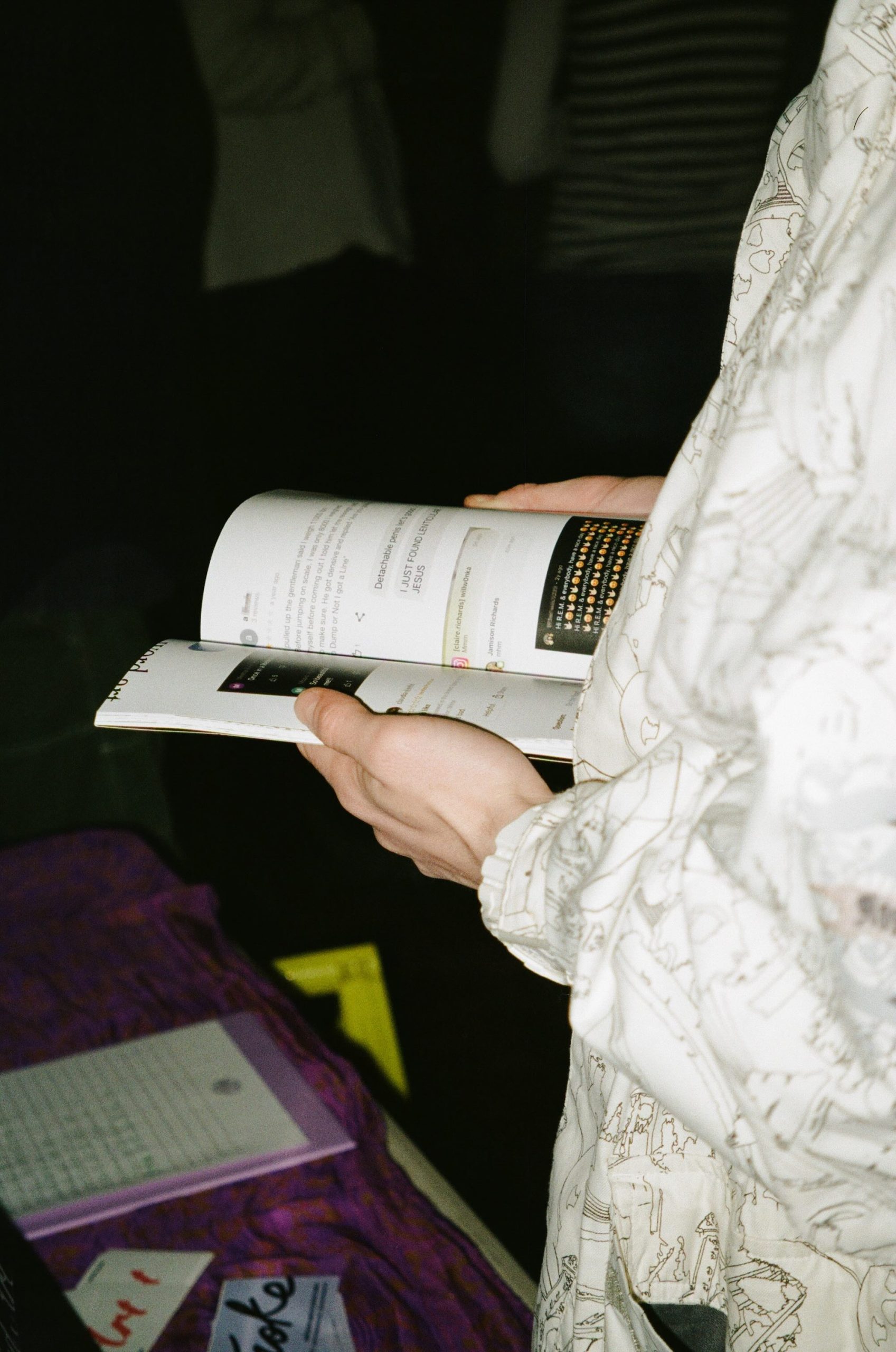 An attendee of the Word Art launch party looks through the book.